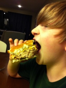 that burger is bigger than his mouth!